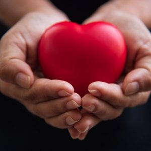 bigstock-close-up-hands-giving-red-hear-263415898_1_621x621