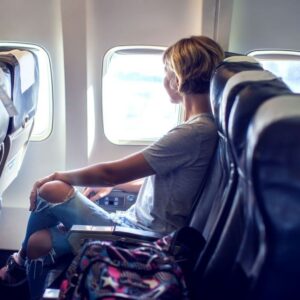 bigstock-passenger-traveler-looking-at-255544057_1_621x621