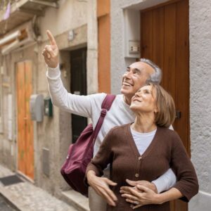 bigstock-cheerful-mature-travelers-coup-473659551_1_621x621