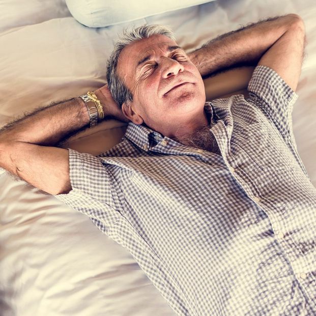 bigstock-senior-man-sleeping-on-a-white-244851232_1_621x621