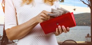 Close,Up,Female,Hands,Taking,Money,From,The,Red,Wallet.